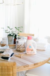 laundry soap and clothes pins on kitchen table