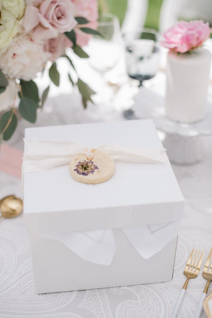 white lunch box with pressed floral sugar cookie detail