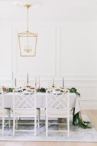 Christmas tablescape with white dinning chairs