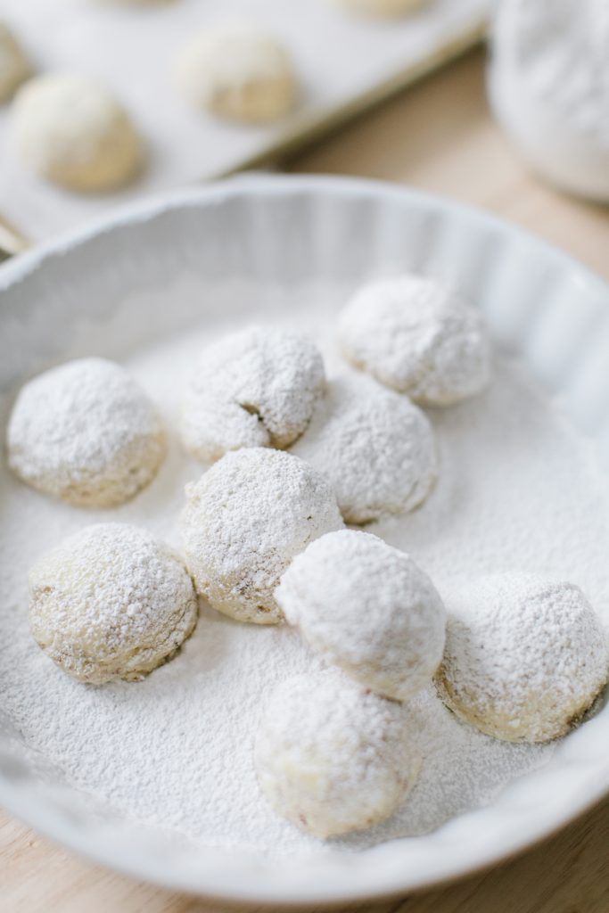 almond snowball cookies in icing sugar