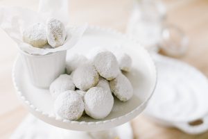 almond snowball cookies on pedestal