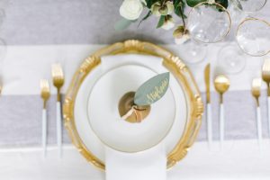 Pear decor on white plate set with a paper leaf name tag
