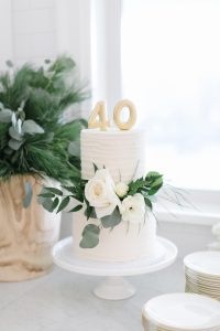 40th two tier white birthday cake with floral decor