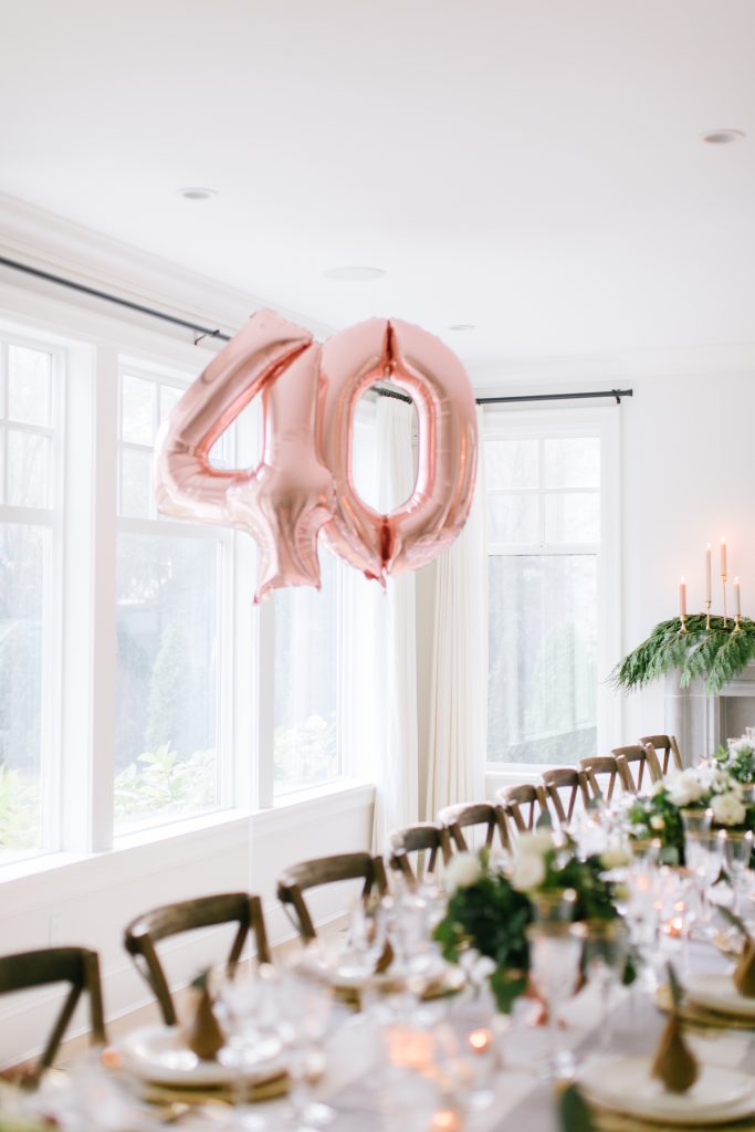 Pink 40 inflatable balloons decor by a window