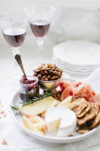 winter cheese plate with cranberry compote and mixed nuts