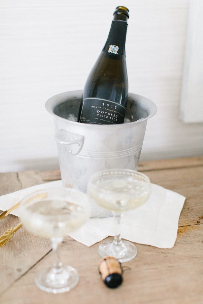 Champagne in bucket with pretty coupes