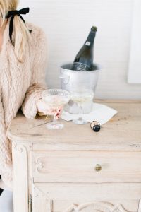 women holding pretty champagne coupe