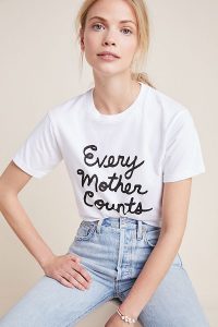 women wearing every mother counts shirt