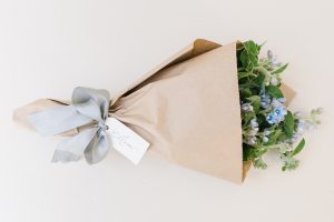 bouquet of soft blue flowers wrapped