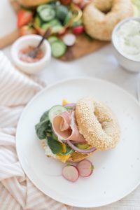 bagel Sandwich with onion, eggs and prosciutto