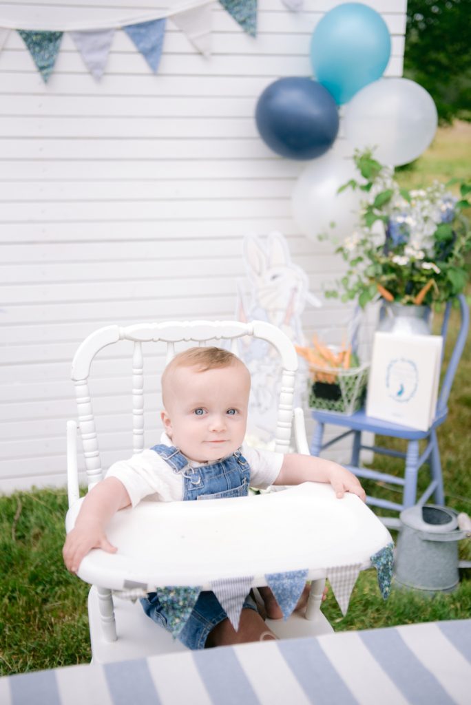 birthday baby in white high chair