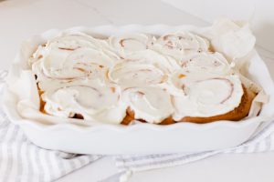 iced Cinnamon Buns in a porcelain baker