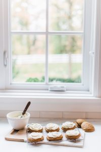 Soft Pumpkin Cookies with Cream Cheese Frosting by Window