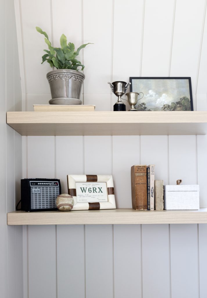 Styled shelf with plant and frames